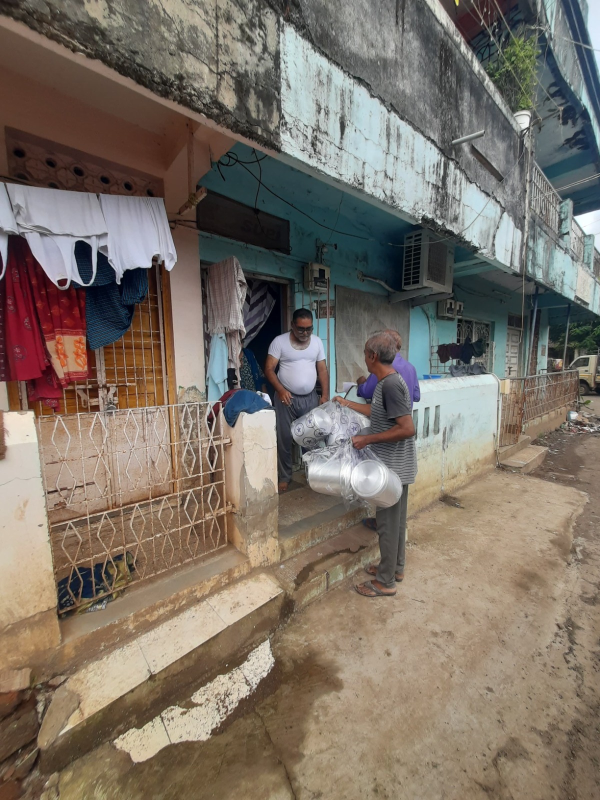 Distribution of kitchen containers door to door in Bilimora