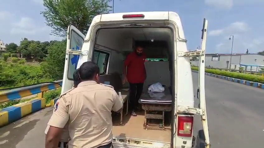 Ambulance rear view with police personnel