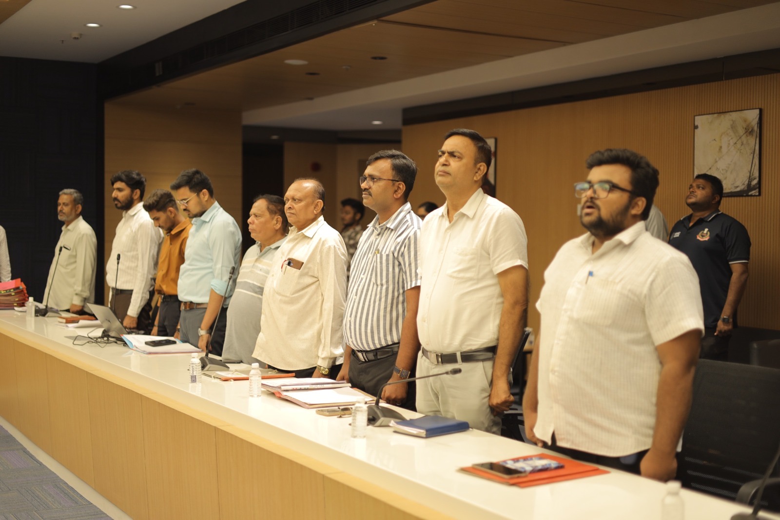 Committee members standing during the meeting
